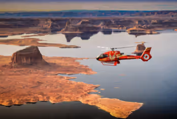 Red helicopter flying over Lake Powell from Page, Arizona