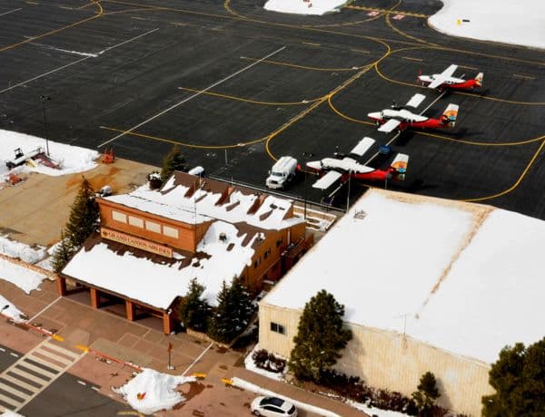 Aerial view of South Rim airport with snow and planes