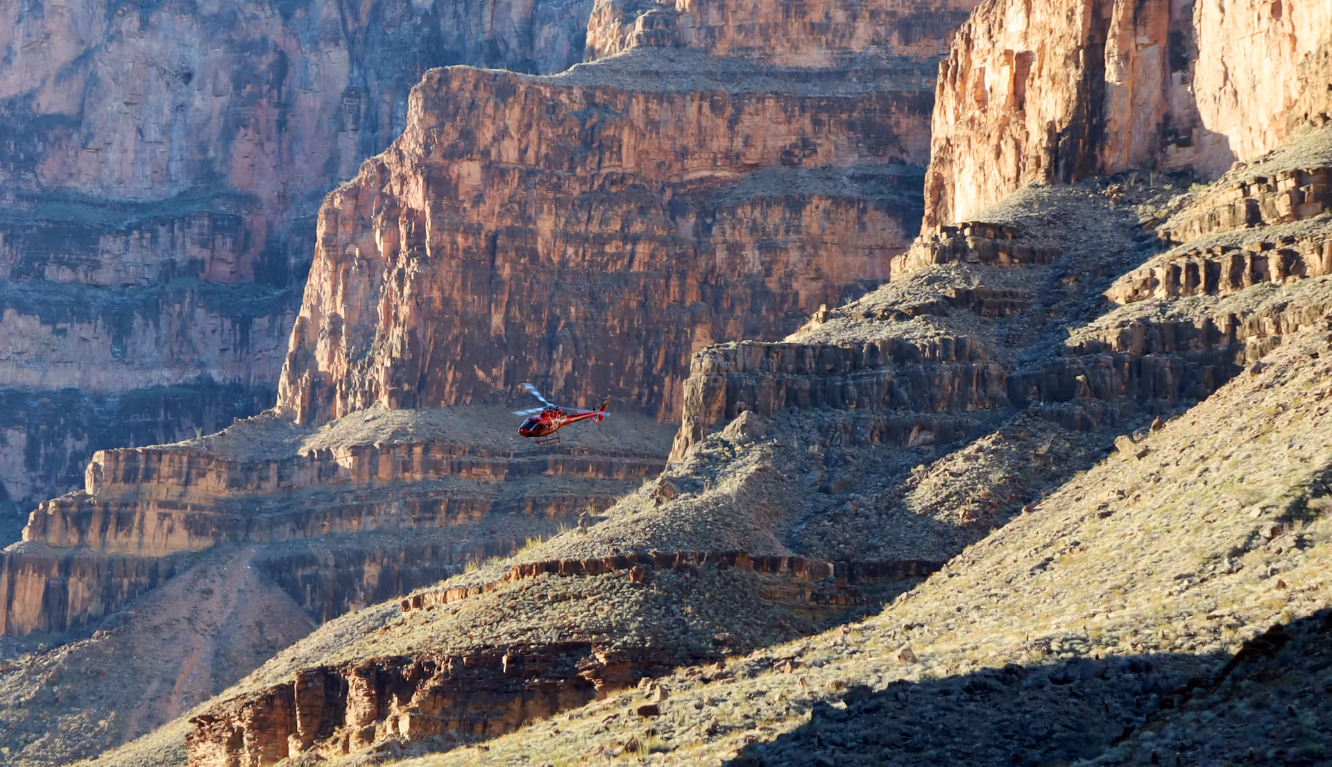 A-Star helicopter flying through Grand Canyon West Rim